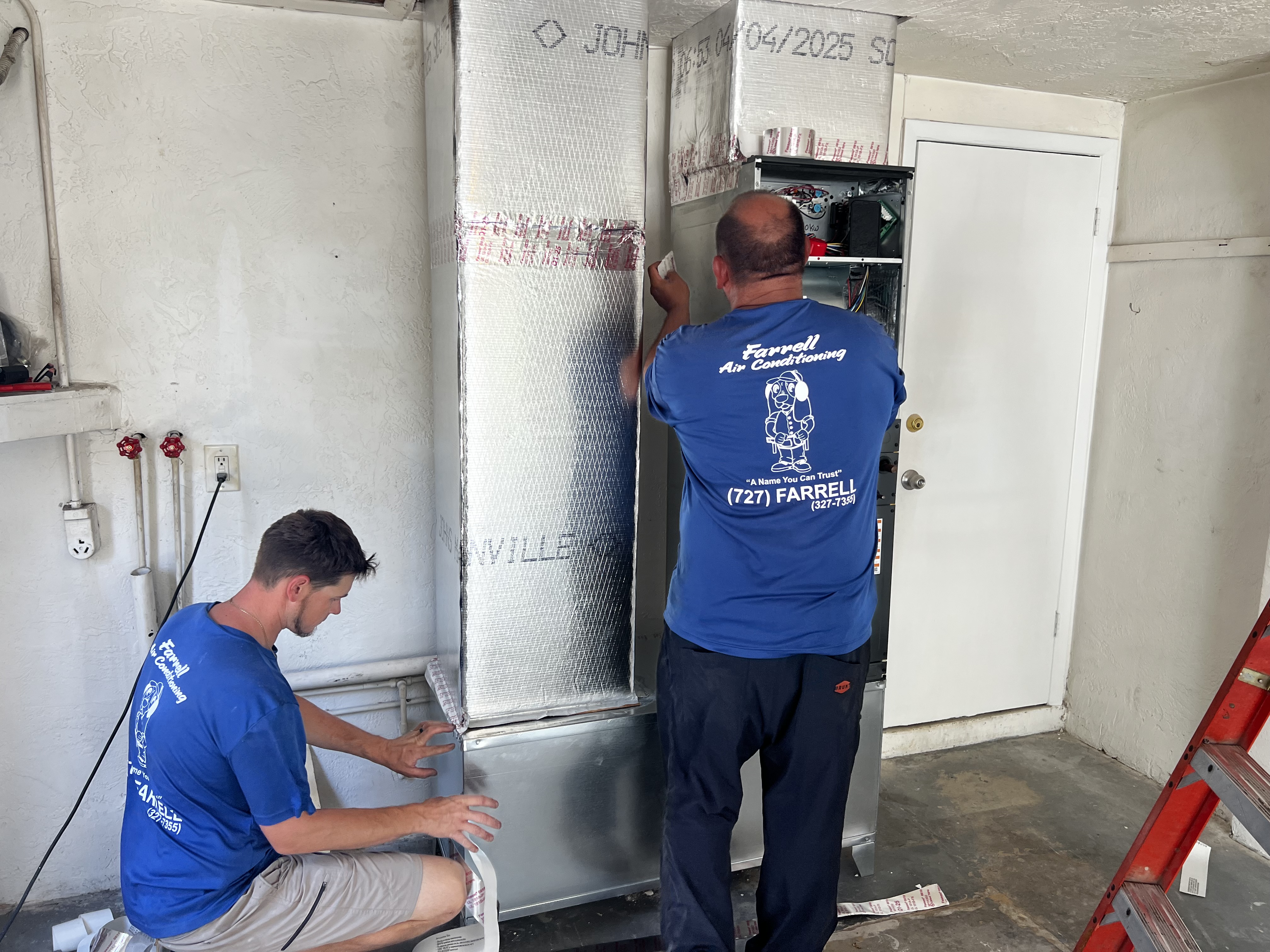Farrell AC technicians working on-site