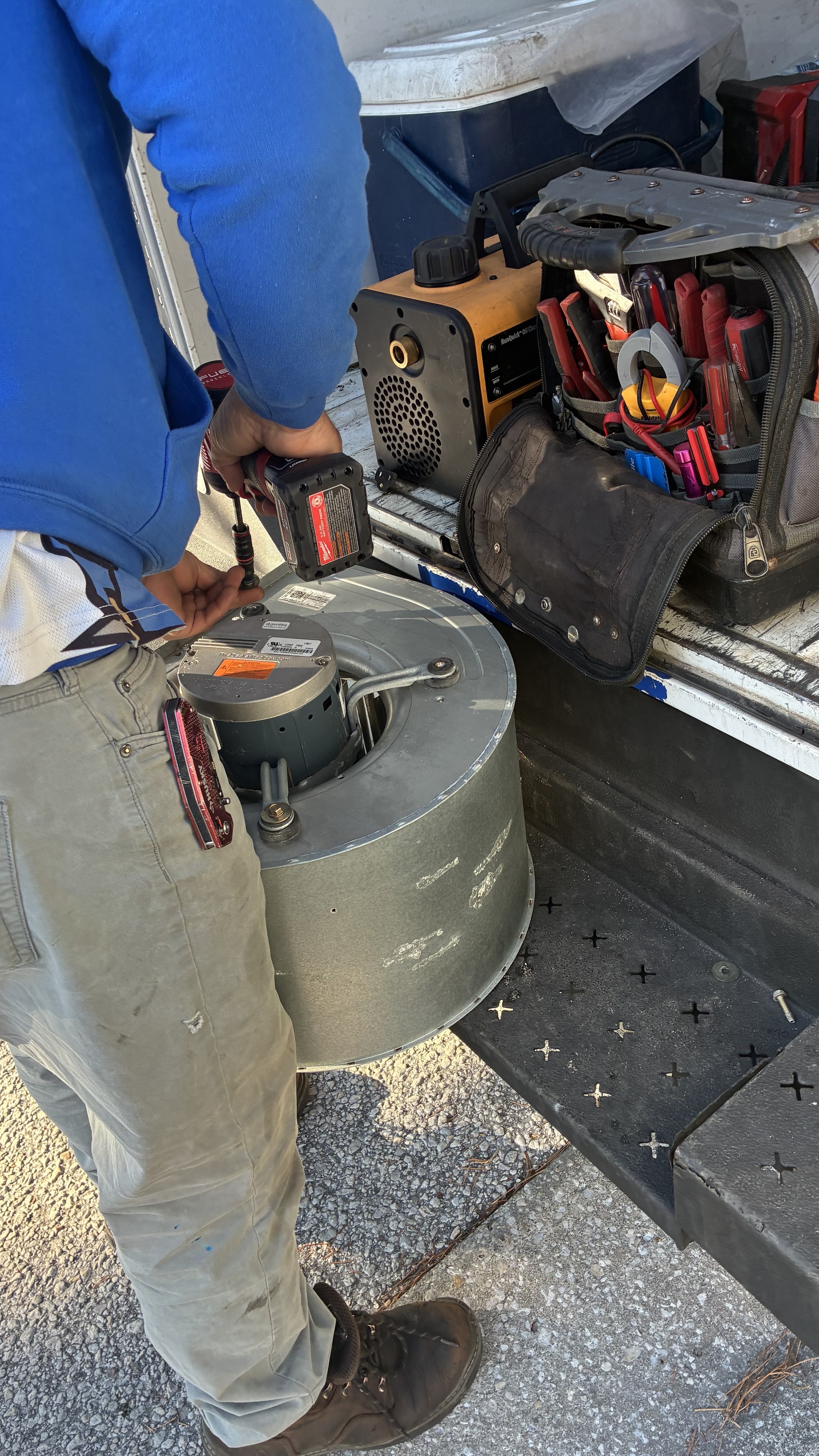 Farrell AC technician repairing a blower motor